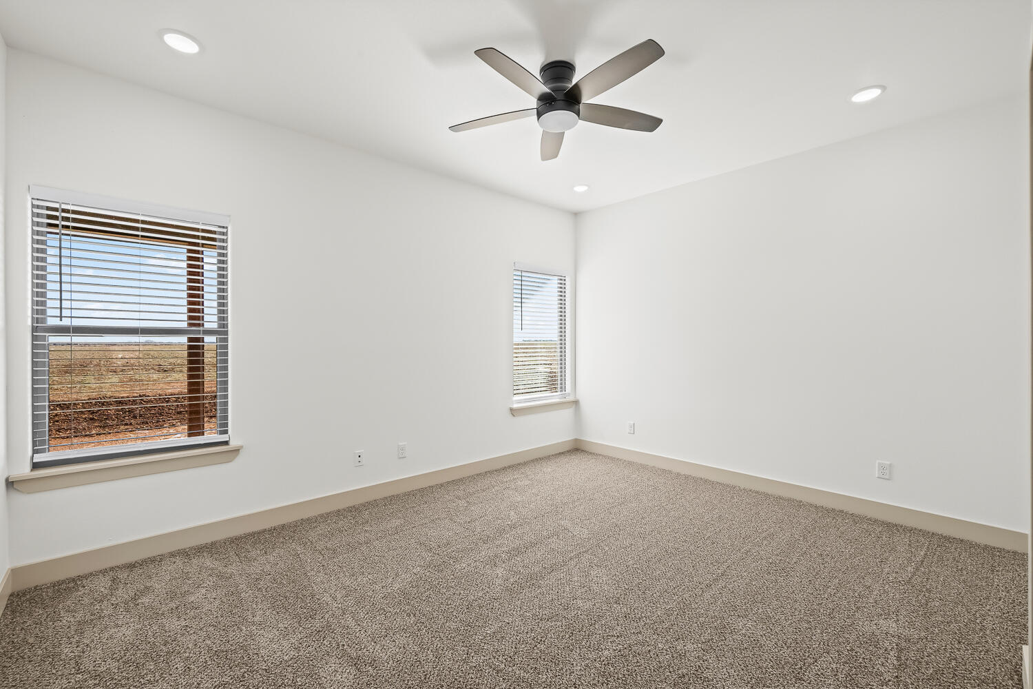 8412 North County Road 1300 Shallowater, TX 79363 - Photo 37 of 43 an empty room with a window and a ceiling fan