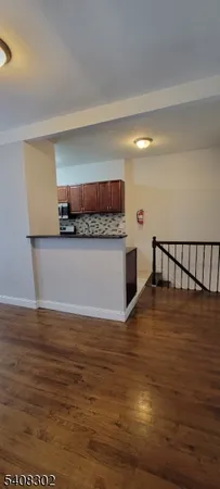 a bathroom with a sink vanity and toilet