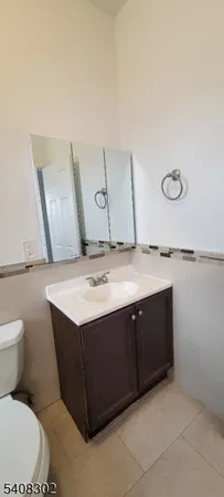 a bathroom with a sink a toilet and bathtub