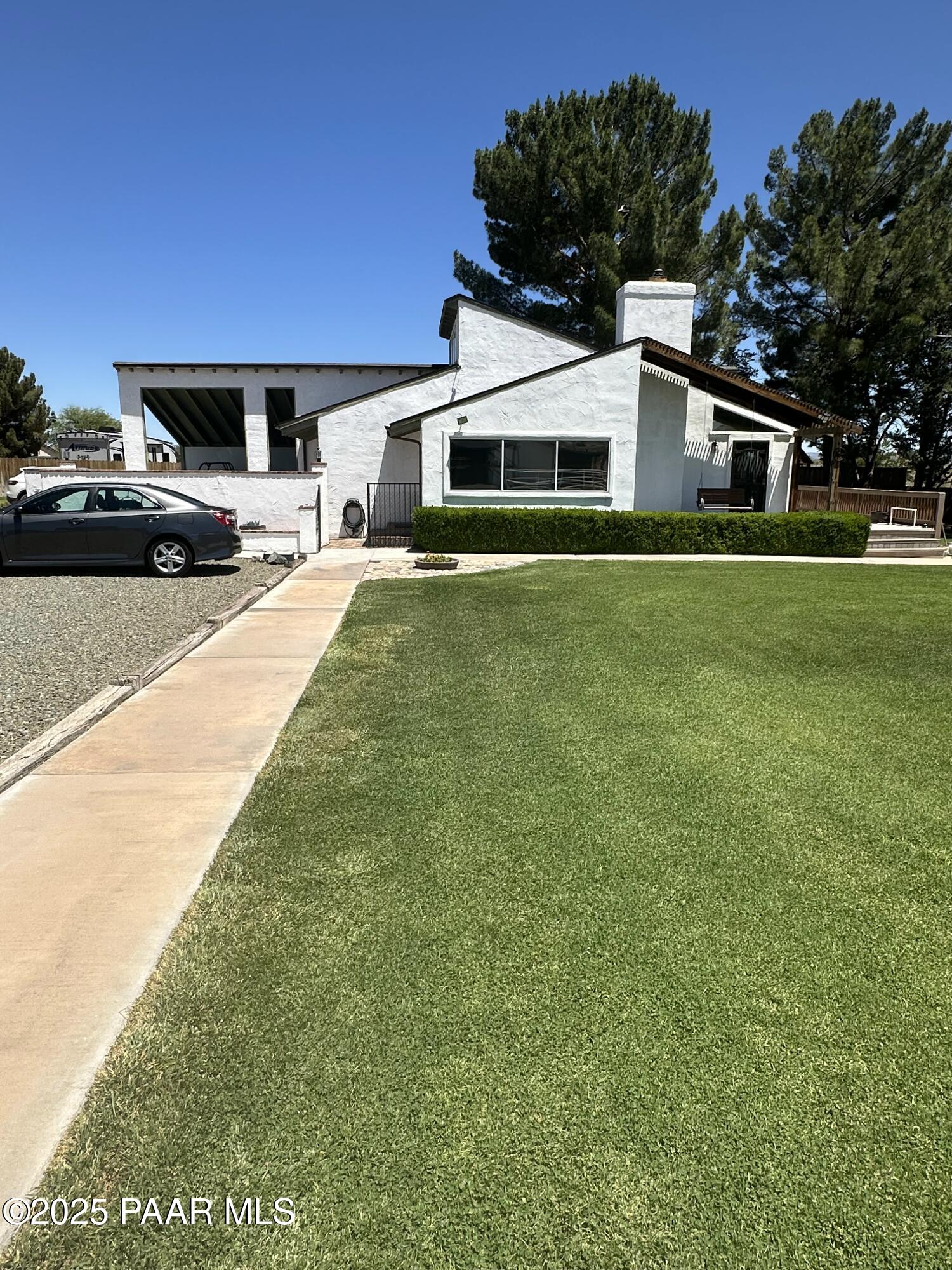 13502 South Burton Road Mayer, AZ 86333 - Photo 1 of 46 a front view of a house with a yard