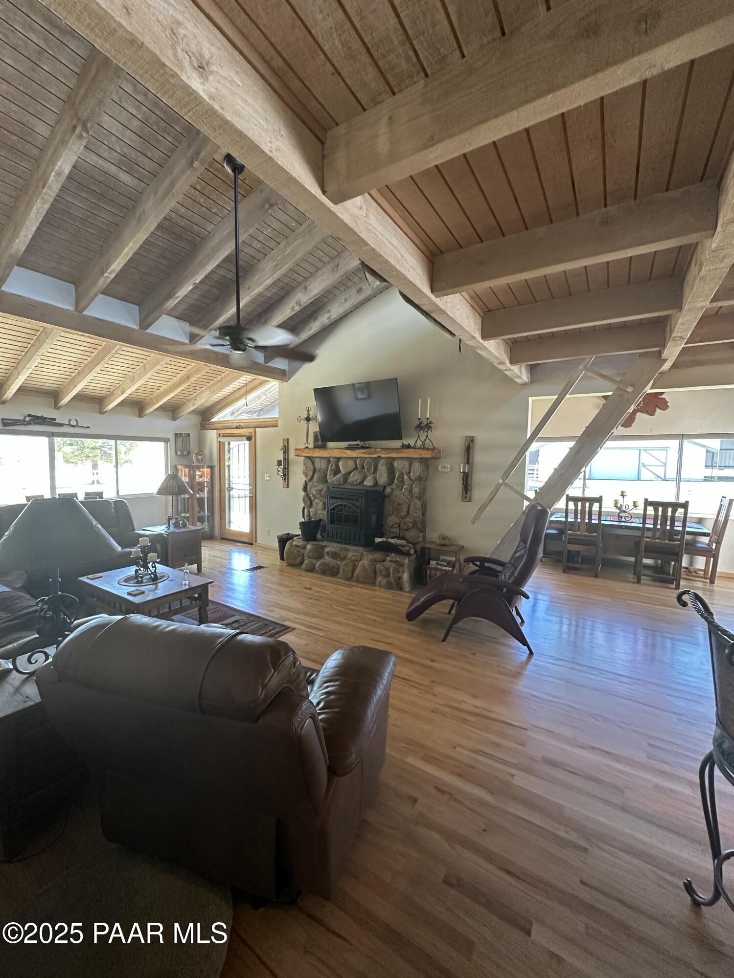 13502 South Burton Road Mayer, AZ 86333 - Photo 27 of 46 a living room with furniture and a wooden floor