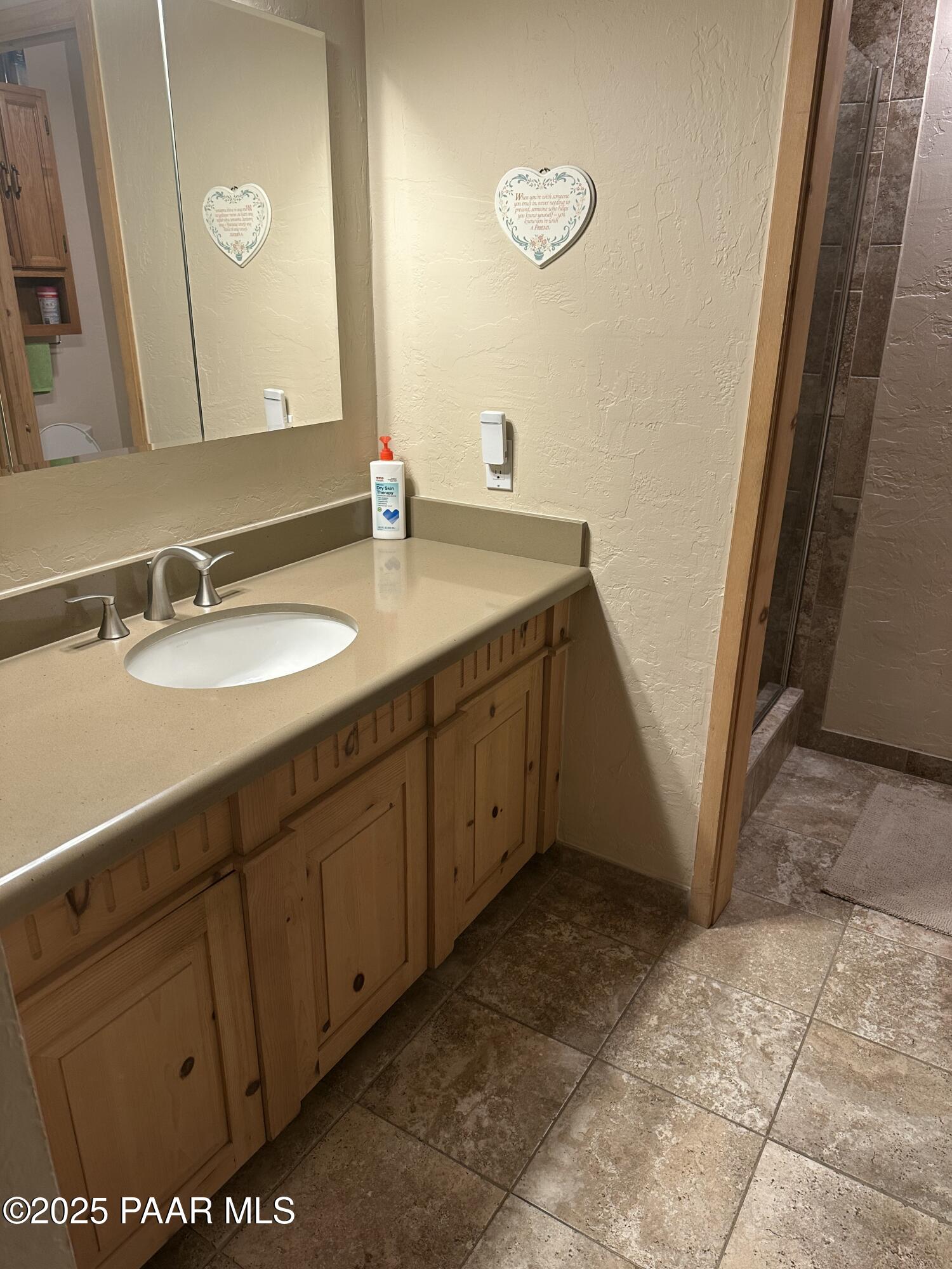 13502 South Burton Road Mayer, AZ 86333 - Photo 35 of 46 a bathroom with a sink and a mirror