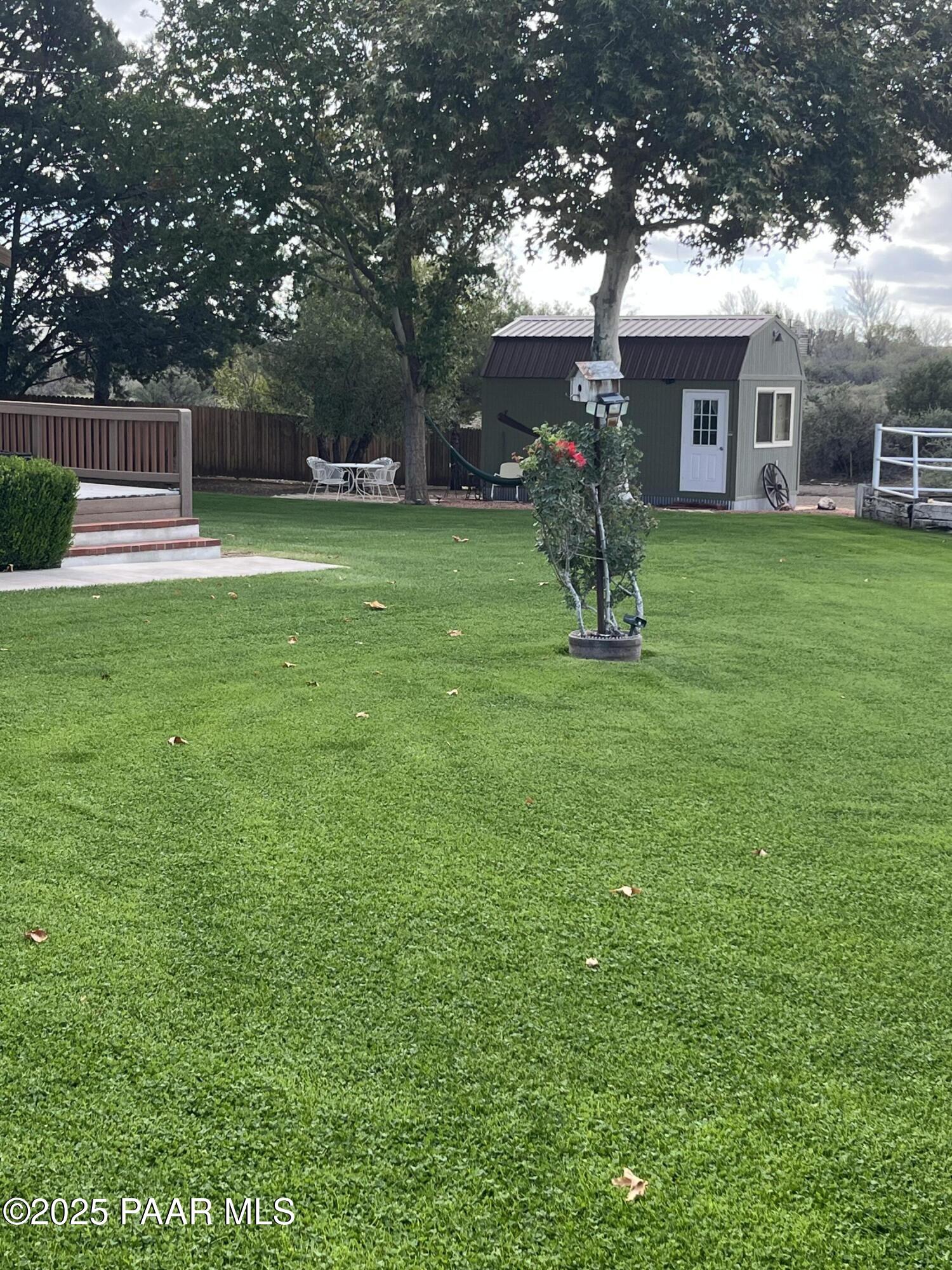 13502 South Burton Road Mayer, AZ 86333 - Photo 6 of 46 a house view with a sitting space and garden