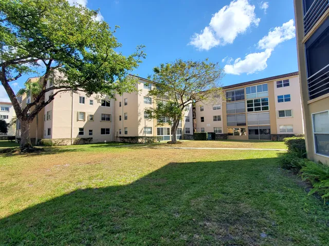 a swimming pool view with a outdoor seating