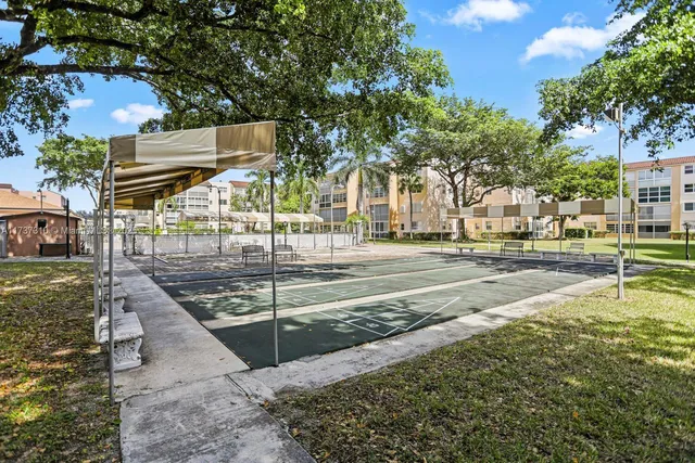 a view of a swimming pool with a yard