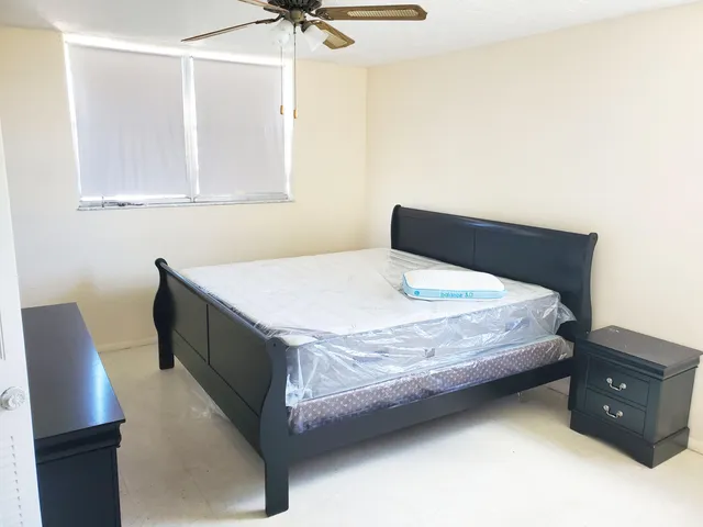 a bedroom with a bed and a closet