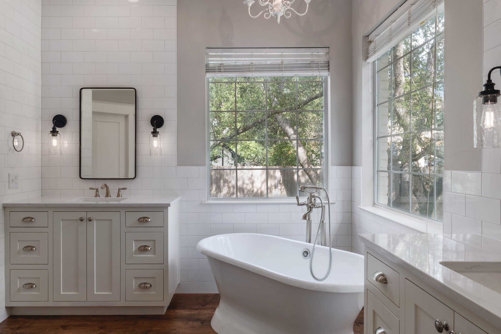 5512 Ballenton Lane Austin, TX 78739 - Photo 20 of 40 A deep soaking tub and dual vanities highlight this bright, spacious primary bathroom.