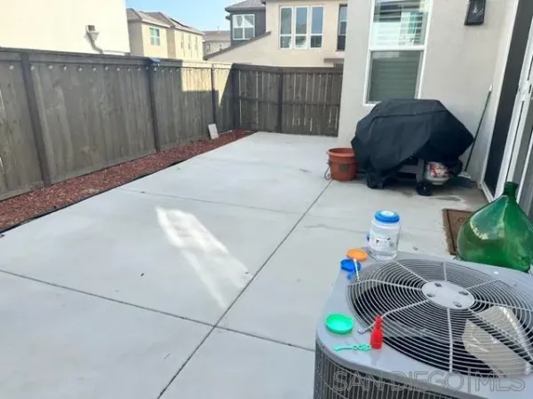 a view of backyard with tub
