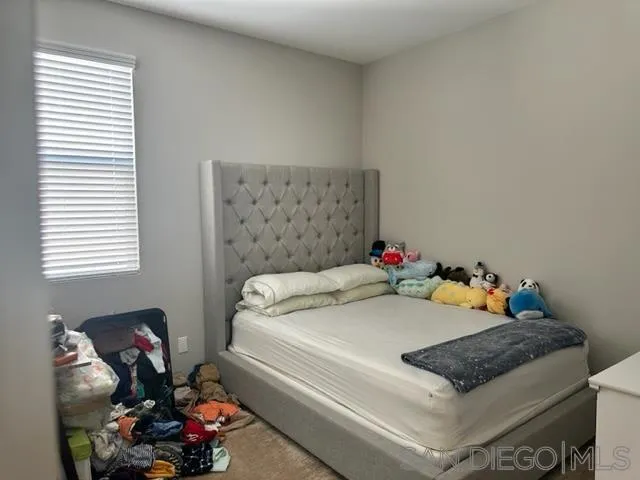 1767 Whitmore Loop Chula Vista, CA 91913 - Photo 15 of 22 a bedroom with a bed and a dresser
