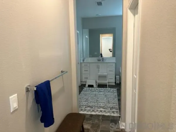 a bathroom with a shower and a mirror
