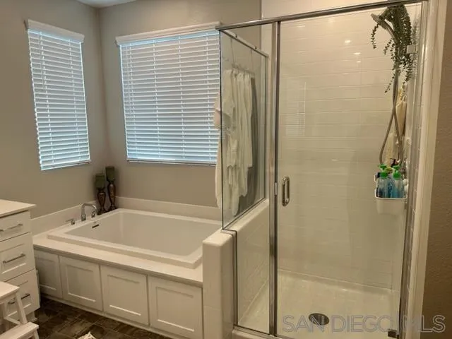 1767 Whitmore Loop Chula Vista, CA 91913 - Photo 21 of 22 a bathroom with a bathtub and a shower