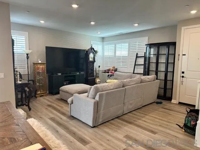 1767 Whitmore Loop Chula Vista, CA 91913 - Photo 6 of 22 a living room with furniture and a flat screen tv