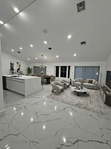 a living room with furniture and a table