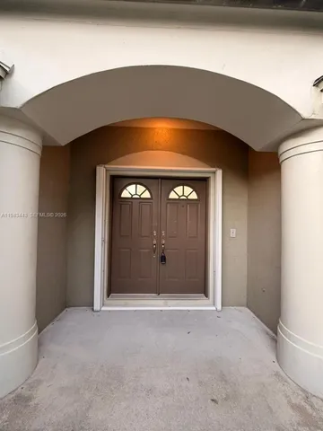 a view of an empty room with a fireplace