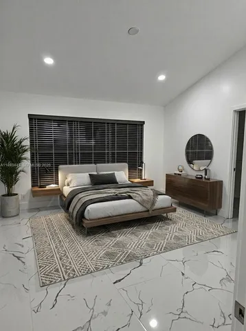 a spacious bathroom with a double vanity sink a mirror and a shower