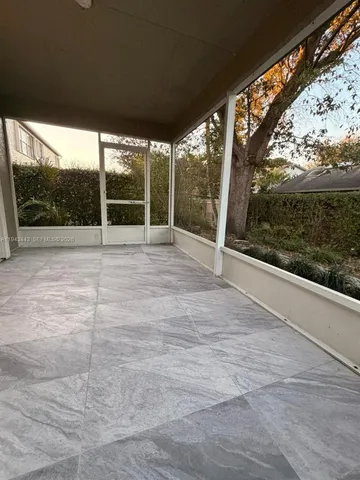 a view of empty room with yard and mountain view