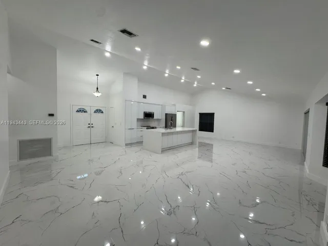 a view of a big room with white walls