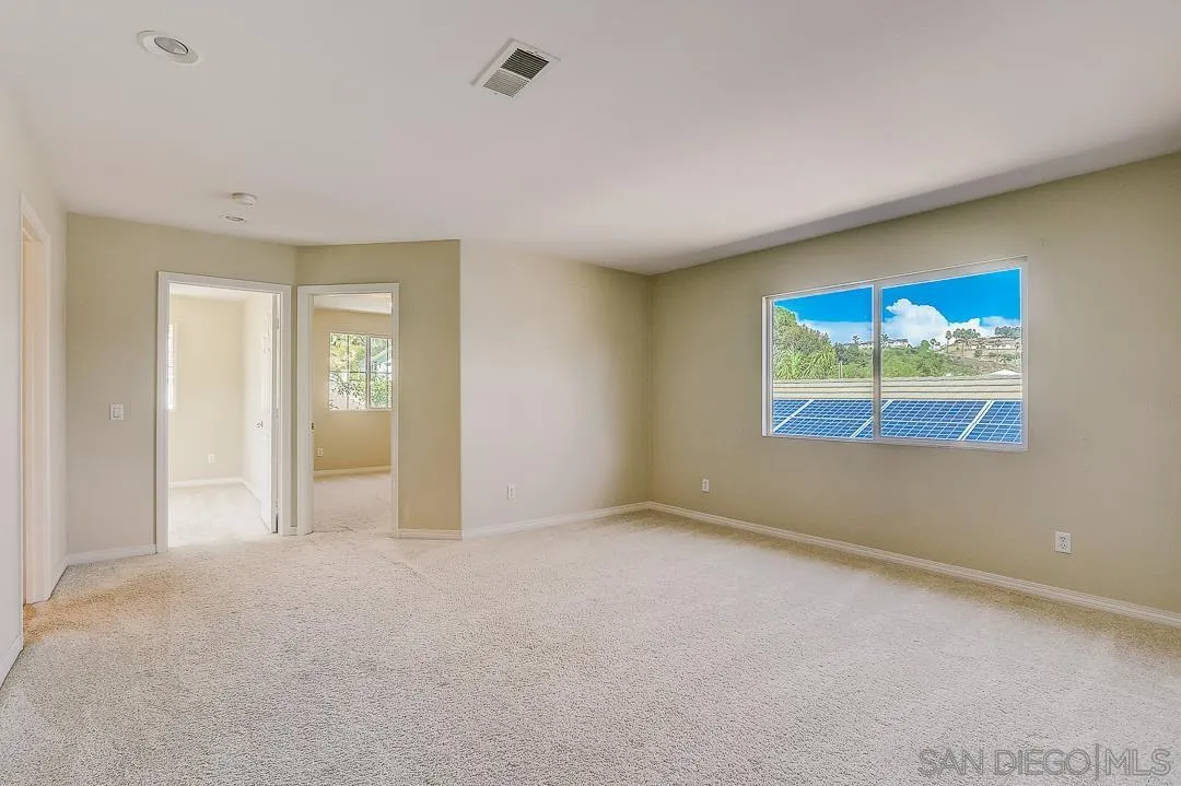 551 Dundee Lane San Marcos, CA 92069 - Photo 11 of 30 an empty room with windows