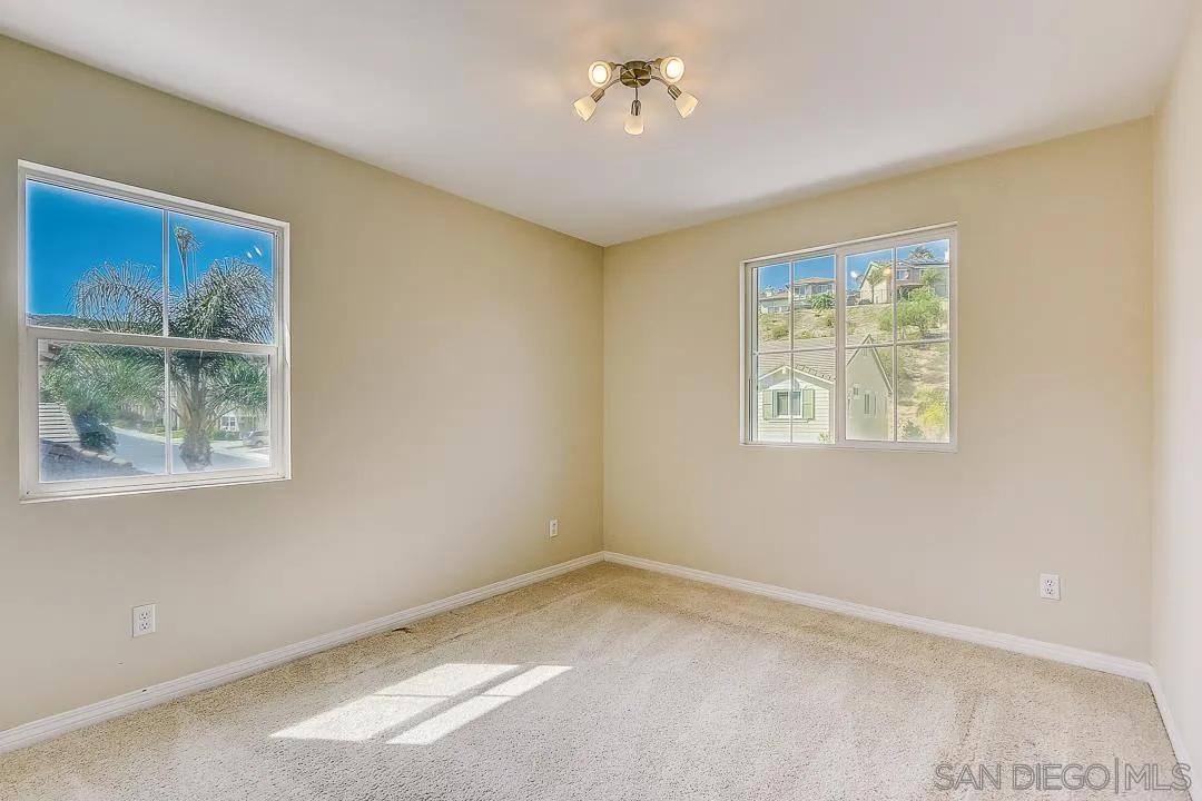 551 Dundee Lane San Marcos, CA 92069 - Photo 14 of 30 an empty room with a window