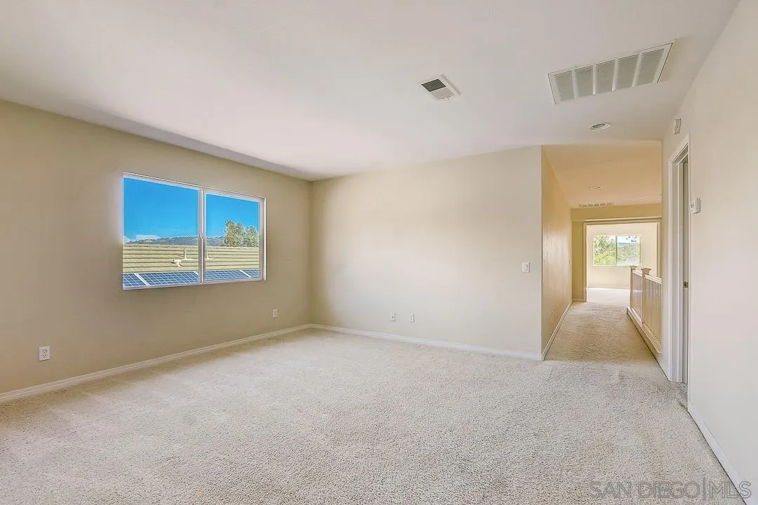 551 Dundee Lane San Marcos, CA 92069 - Photo 17 of 30 a view of an empty room with a window