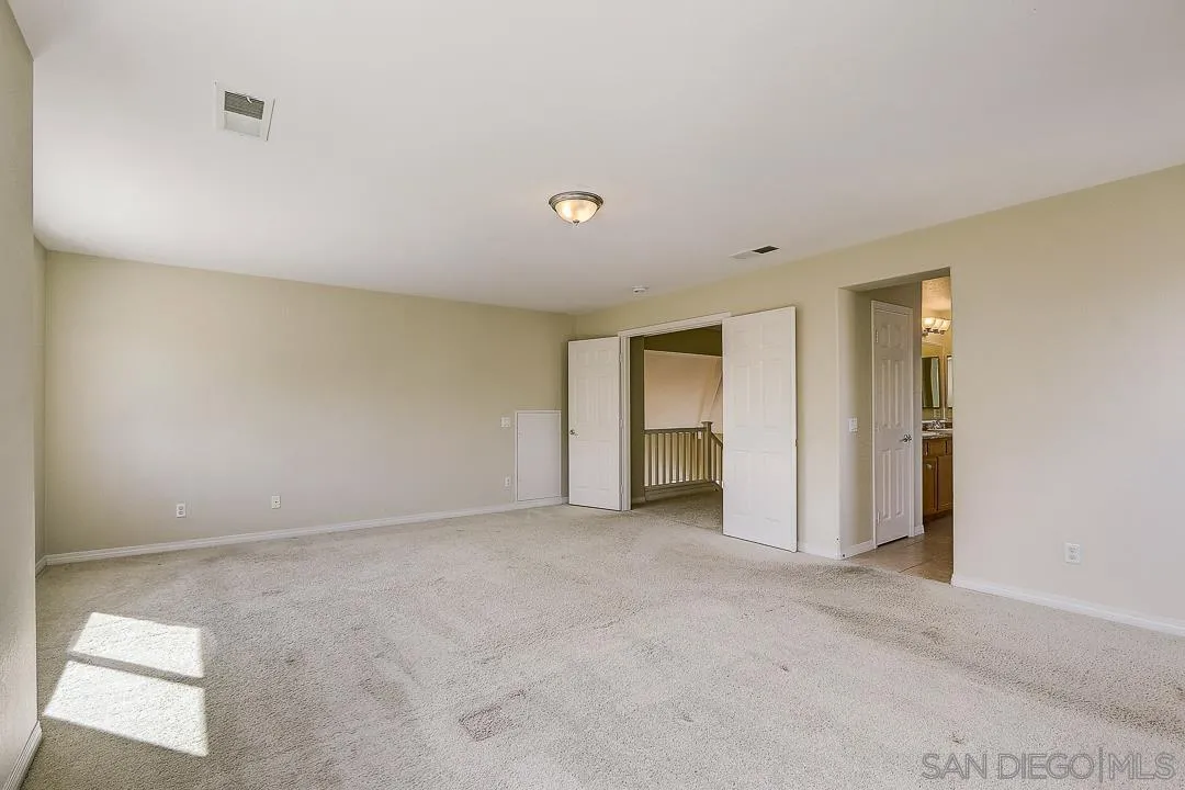 551 Dundee Lane San Marcos, CA 92069 - Photo 20 of 30 a view of an empty room with a window