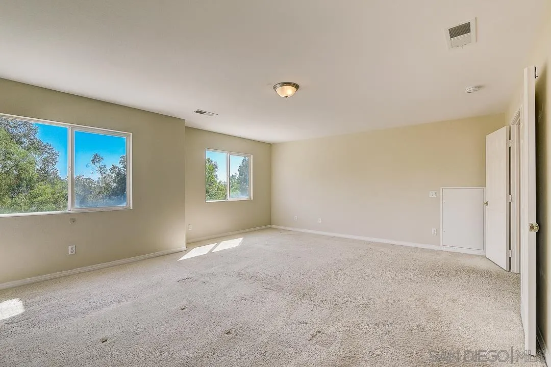 551 Dundee Lane San Marcos, CA 92069 - Photo 21 of 30 an empty room with windows