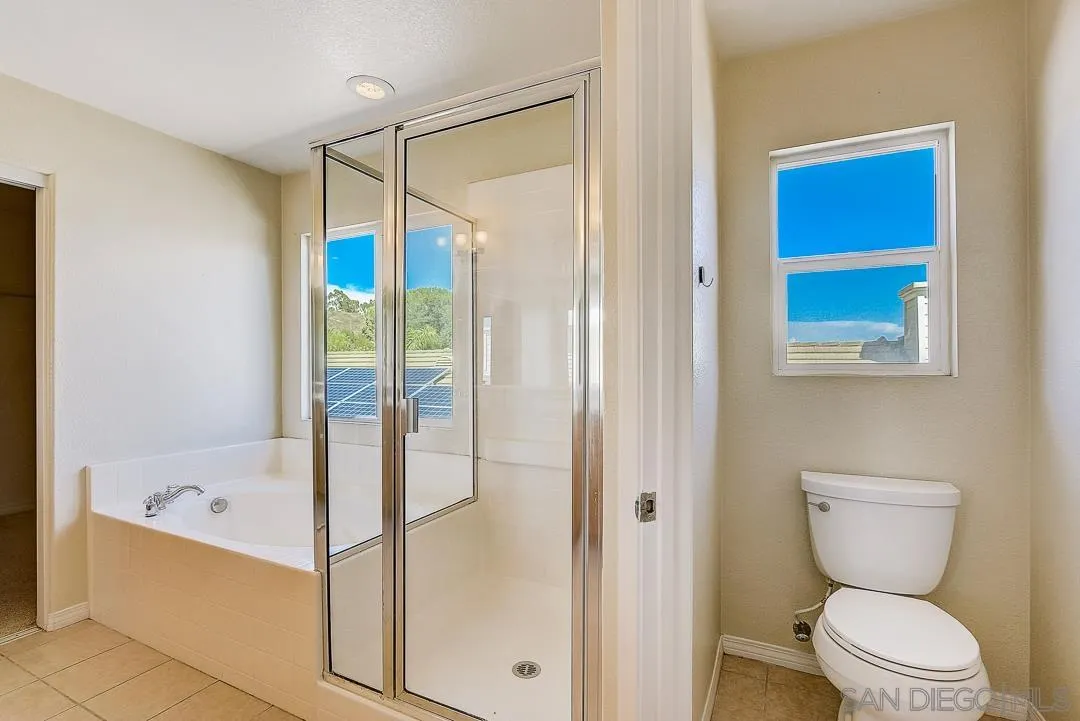 551 Dundee Lane San Marcos, CA 92069 - Photo 24 of 30 a bathroom with a toilet and a bathtub