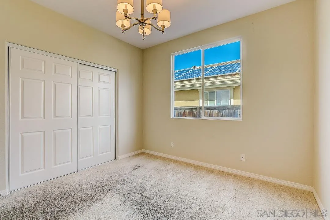 551 Dundee Lane San Marcos, CA 92069 - Photo 27 of 30 an empty room with a window