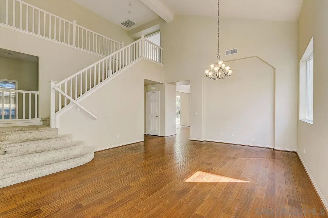 551 Dundee Lane San Marcos, CA 92069 - Photo 7 of 30 a view of entryway and hall with wooden floor