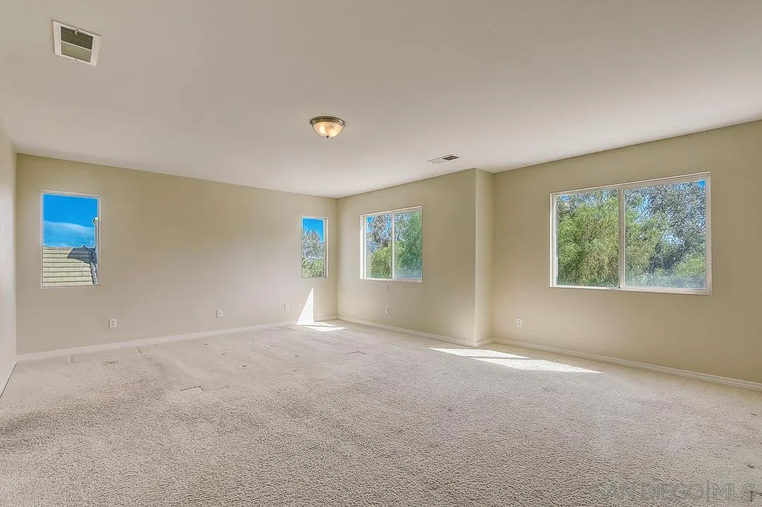 551 Dundee Lane San Marcos, CA 92069 - Photo 9 of 30 a view of an empty room with a window