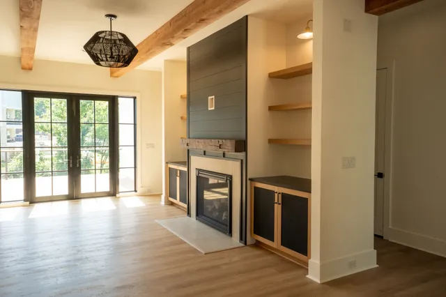 a hallway with a stove and a large window