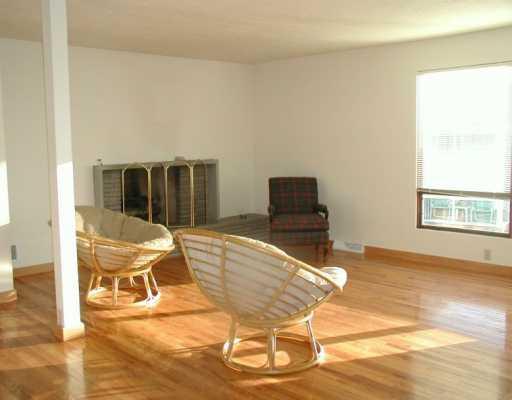 100 Rhodes Avenue Green Tree, PA 15220 - Photo 2 of 6 Living Room. Liiving room boasts fireplace and gleaming hardwood flooring. Windows all have mini blinds installed