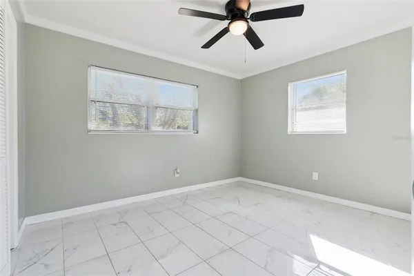 a view of an empty room with a window