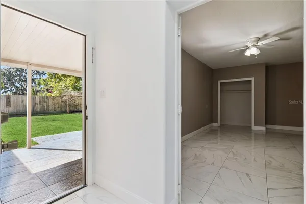 a view of an empty room with a window