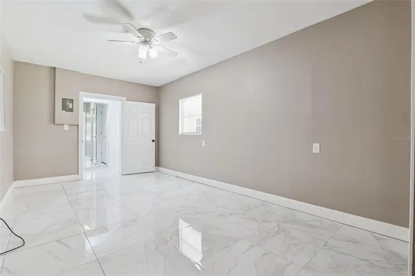 a view of an empty room with a window