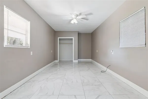 a view of an empty room with a window