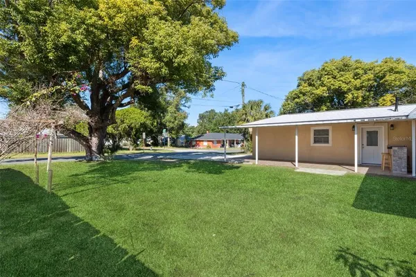 a view of a house with a back yard