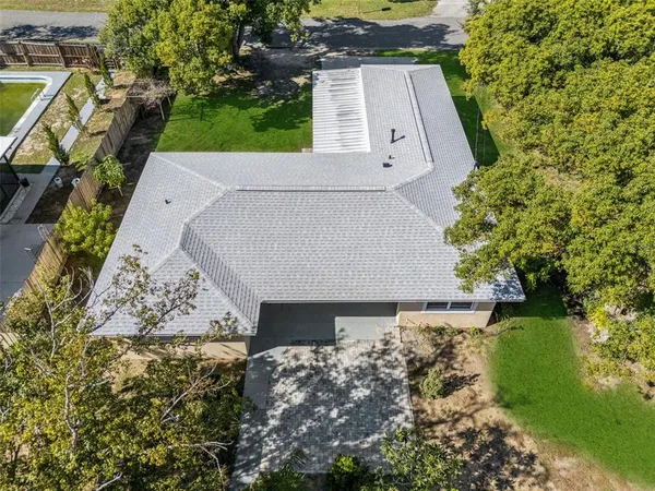 an aerial view of house with yard