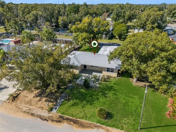 an aerial view of house with yard