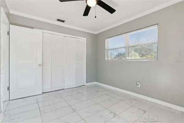a view of an empty room with a window
