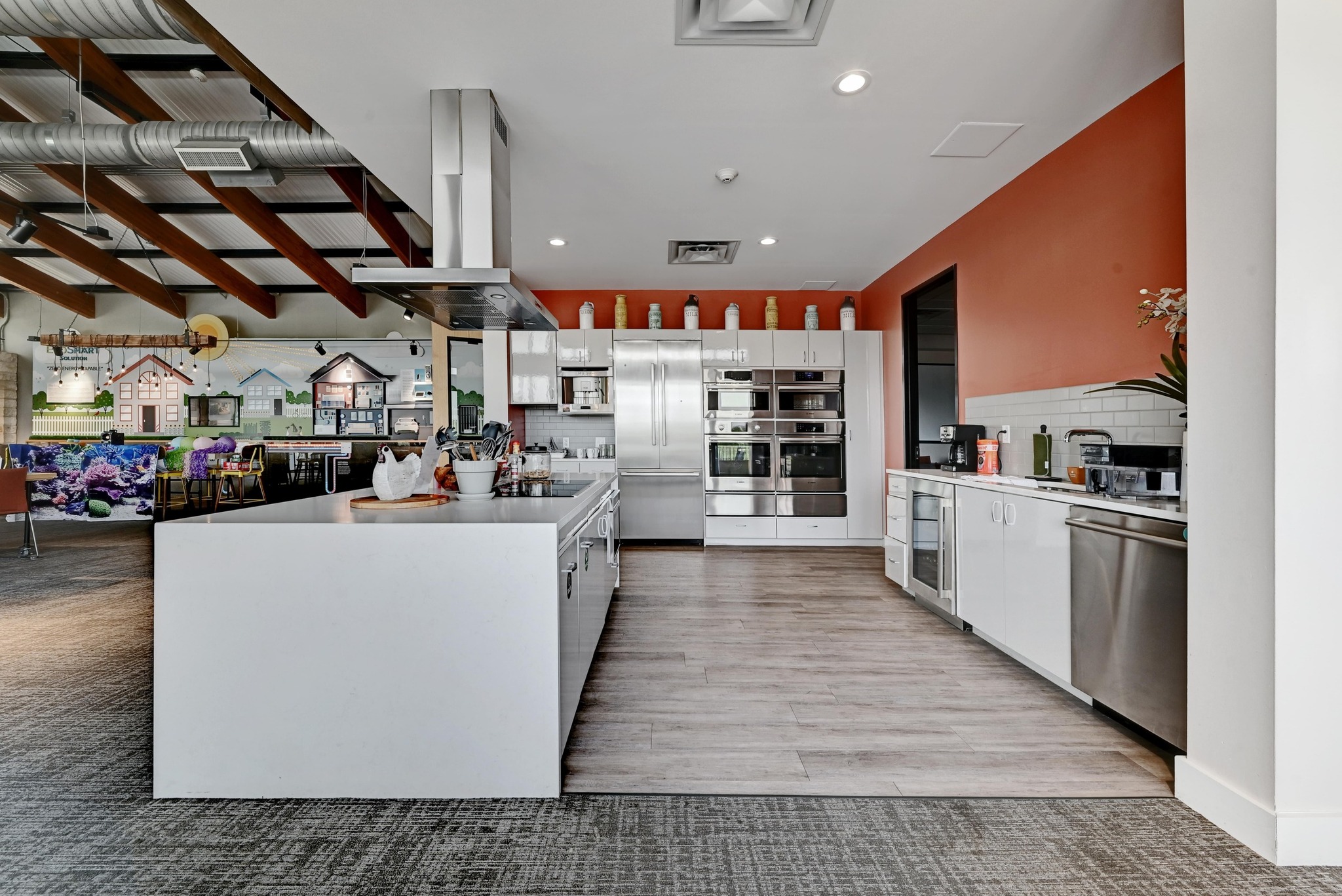 16400 Fetching Avenue Manor, TX 78653 - Photo 22 of 32 Kitchen featuring island range hood, white cabinetry, stainless steel appliances, recessed lighting, and a spacious island