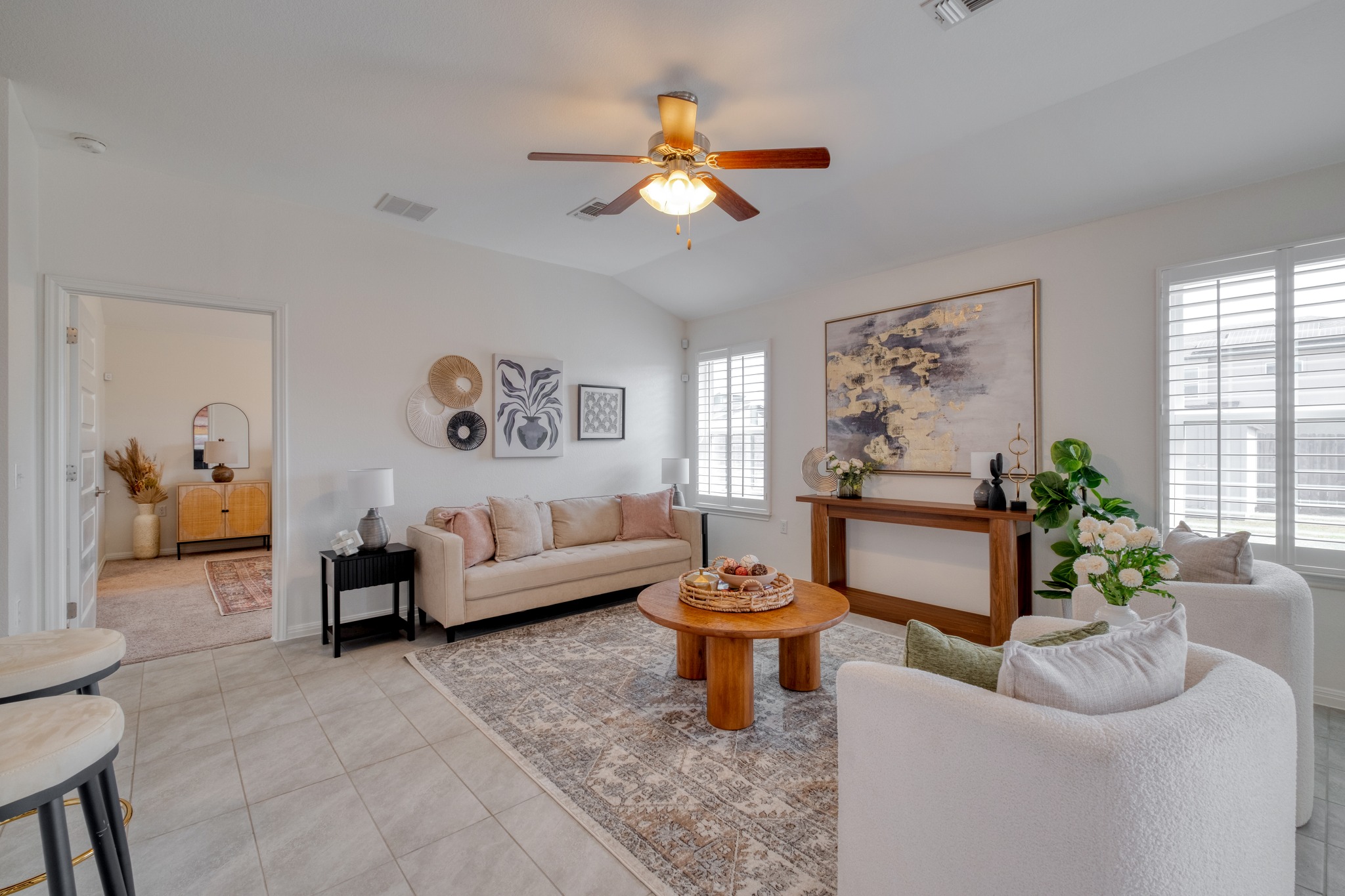 16400 Fetching Avenue Manor, TX 78653 - Photo 6 of 32 Living area featuring a ceiling fan, vaulted ceiling, and light tile patterned flooring