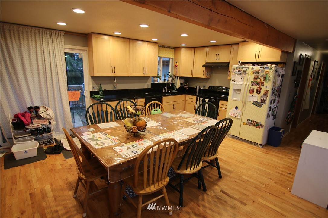 1518 South 28th Street Renton, WA 98055 - Photo 4 of 21 a large kitchen with a table and chairs