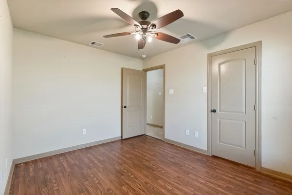 a bathroom with a bathtub and a toilet