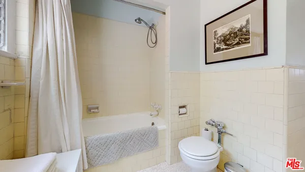 a bathroom with a toilet a sink and a bathtub