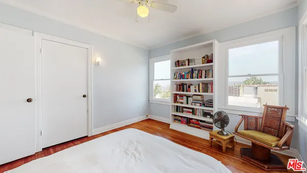 a room with a workspace and a window