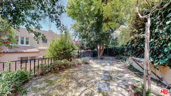 a view of backyard with seating space