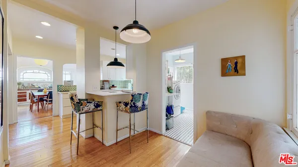 a view of a livingroom with furniture and wooden floor