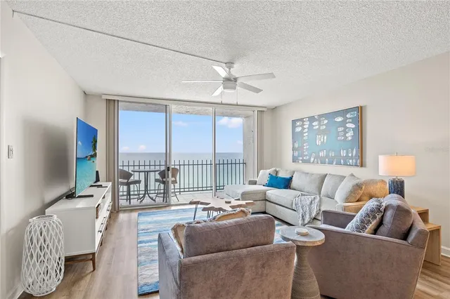 a kitchen with stainless steel appliances kitchen island granite countertop a sink a stove and cabinets