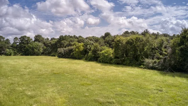 a view of a yard with an outdoor space